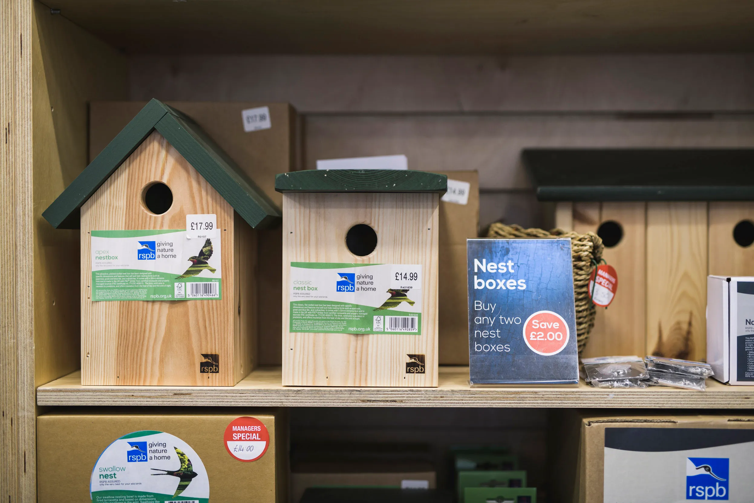 Close up of bird and nest boxes on an in store display.